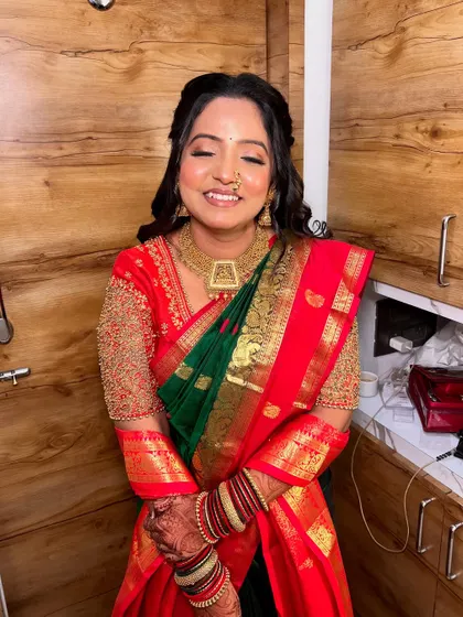 A moment of pure happiness. The makeup is designed to be long-lasting and picture-perfect, ensuring she looks flawless from every angle, even in candid shots.