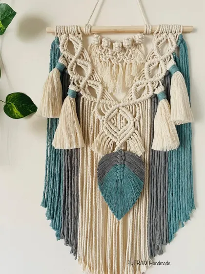 A full look at the 'Bella' tapestry. The combination of colors and textures with the tassels and leaf makes it a really unique piece of wall art.