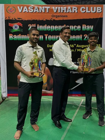 A Group Men's Doubles winners and runners-up.