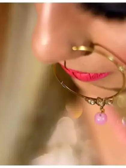 A cinematic close-up of the bride's nose ring, with a soft, dreamy background that puts all the focus on this beautiful piece of jewelry.
