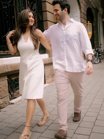 A casual stroll through the city streets, capturing the couple's easy-going chemistry and style.