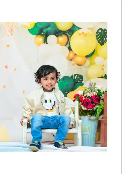 A beautiful, smiling portrait to celebrate turning two. The soft lighting and cheerful background make this a perfect photo to commemorate the milestone.