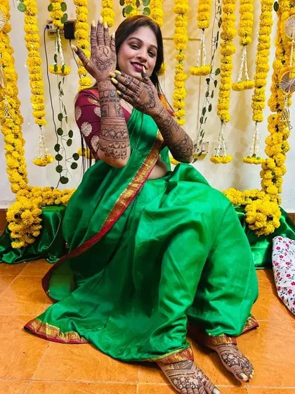 Another shot of the bride's full mehndi, with a clear view of her intricate foot design. The patterns are dense and traditional, perfect for a classic bridal look.