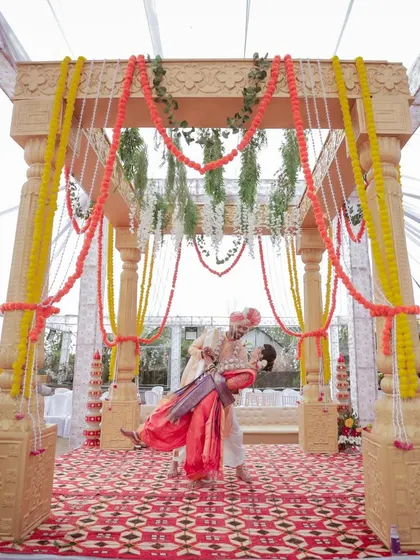 A playful lift at the mandap! We are always ready to capture the fun and spontaneous moments that make a wedding unique.