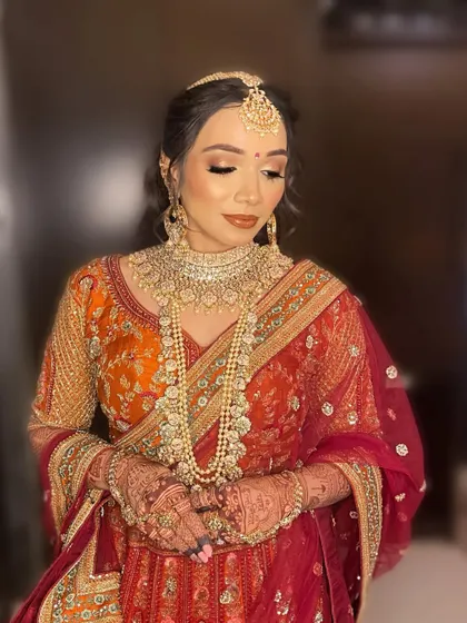 A close-up showcasing the detailed eye makeup for Purva, with a blend of gold and bronze shadows to create a captivating look.