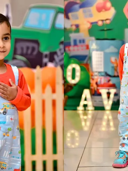 A thrilling 'Hot Wheels' themed birthday party, with checkered flags, car cutouts, and a custom racetrack backdrop, perfect for little speed enthusiasts.