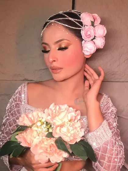 A beautiful "Rose" themed look, featuring soft pink tones and a stunning floral hair accessory. This is a perfect example of a romantic, soft glam style.