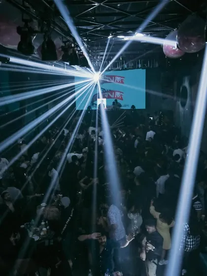The light show at Shimmers Raipur for a New Year's event, creating an incredible visual spectacle over the dance floor.