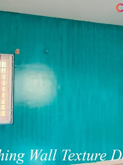 This wall features a Brushing Wall Texture design in a vibrant teal. The technique creates vertical striations that add visual height and a dynamic, handcrafted feel to the room.