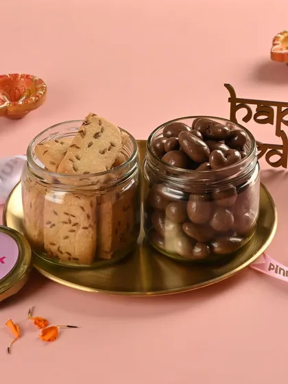 For those who love a mix of sweet and savory, the 'Lazzat' hamper is perfect. It pairs our Jeera Cookies with a jar of indulgent milk chocolate-coated cashews.