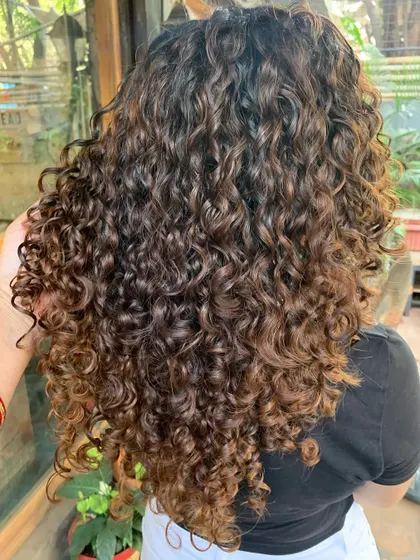 The after shot of our curly hair transformation. The curls are so much more defined and healthy-looking. (No filter)