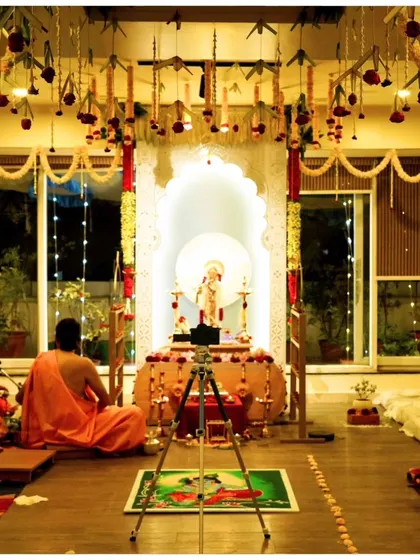 The main puja being performed in front of our altar during Janmashtami. The room is filled with the light of diyas and the sound of mantras, creating a truly sacred and unforgettable night.