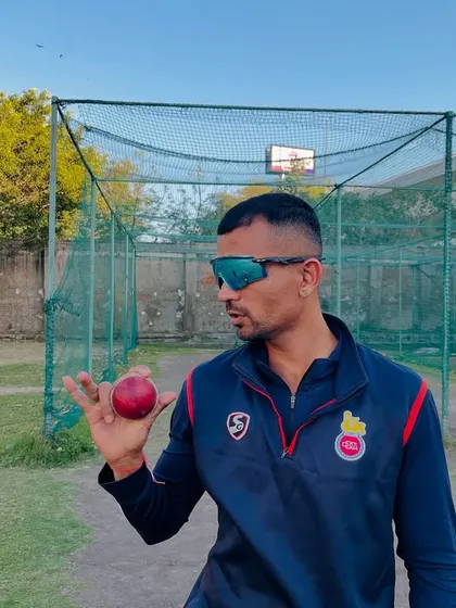 This is the grip for the carrom ball. It's all about holding the ball between the thumb, index, and middle finger to generate the flick that makes it a mystery delivery.