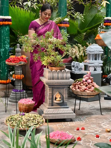 A beautiful setup for Makar Sankranti, featuring a Tulasi Brindavan, a miniature stone chariot, and offerings of flowers and sugarcane. This display honors the harvest festival and our cultural roots.