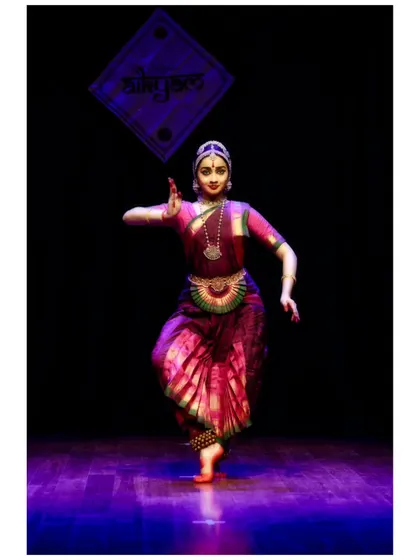 A dynamic pose from a performance at Aikyam 2024, showing the energy and precision of a pure dance sequence.