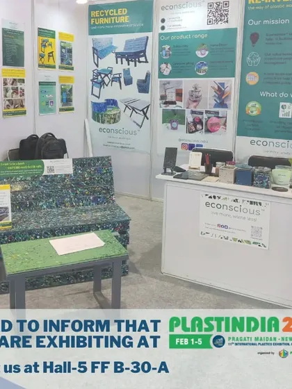 Our booth at Plastindia 2023, with our recycled furniture front and center. The bench and table demonstrate the durability and practical application of our recycled plastic boards.