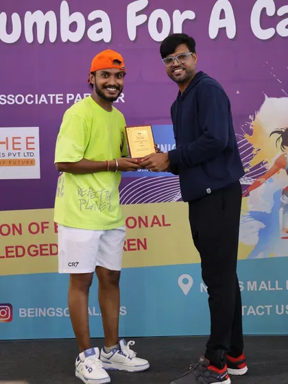 Receiving a token of appreciation for my participation in the charity event. I'm thankful for the opportunity to contribute.