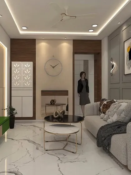 A living room render for a Goregaon project, featuring a neutral grey sofa, a pop of color with a green TV console, and elegant wall paneling. The design balances modern lines with comfortable furnishings.