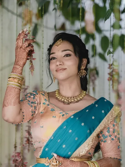 Gorgeous Hema's engagement look. The peach and blue combination of her saree is so refreshing, and I created a soft, romantic makeup look to match.