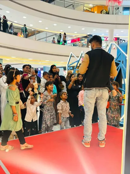 Engaging with the audience is the best part of any live show. Here I am interacting with a young participant during our Eid special performance at Inorbit Mall.