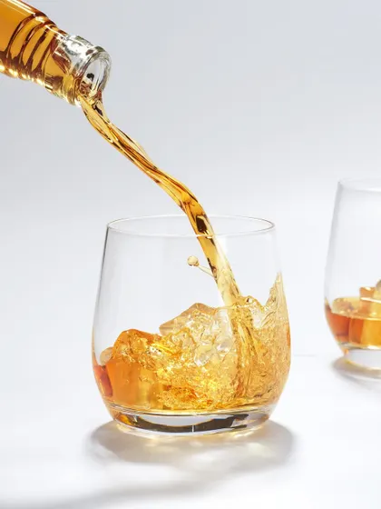 Capturing liquids in motion is like rolling the dice; you never know exactly what you'll get, and that's the magic. This shot freezes the perfect moment of a whiskey pour, capturing the energy of the splash and the beautiful amber color against a clean, high-key background. It’s a technical challenge that is always worth the chase.