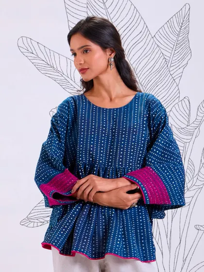 A closer look at our Chaaya relaxed fit top. The combination of hand-block print and an easy silhouette makes it a go-to piece for hot, humid days.