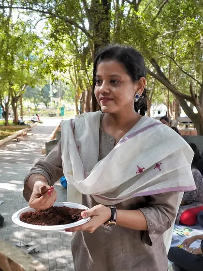 Our instructor demonstrating how to make a seed ball during the workshop at Ramaiah University. The process is simple and easy for everyone to follow.