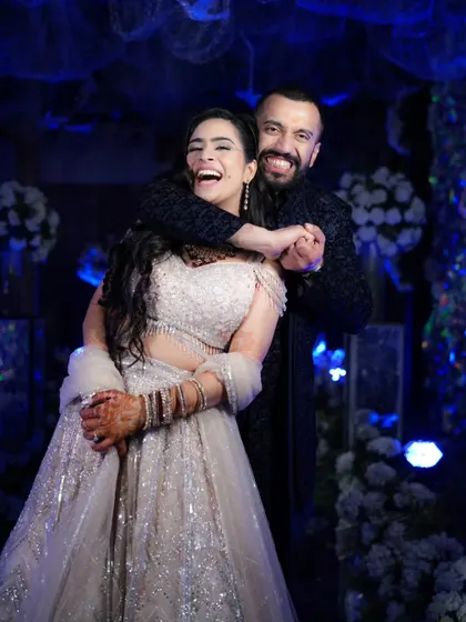 Pure, uninhibited joy. This candid shot of the couple laughing together shows the fun and relaxed atmosphere we strive to capture during your celebrations.