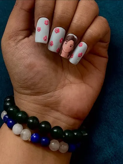 A side view of the Ghibli-style portrait nails, showing how the art looks from different angles.