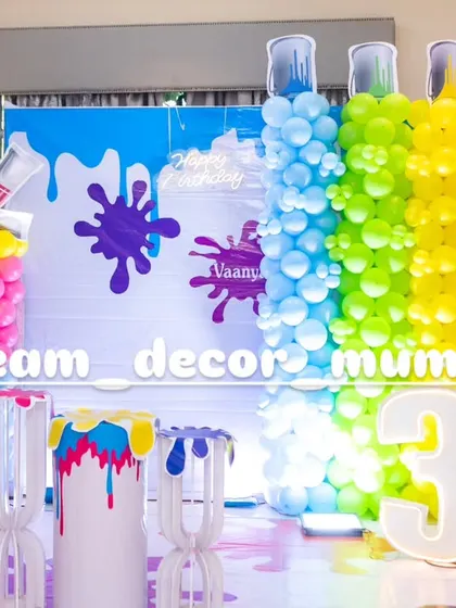 A vibrant and creative Art and Paint themed birthday party, with balloon columns designed to look like paint tubes and colorful splash details.