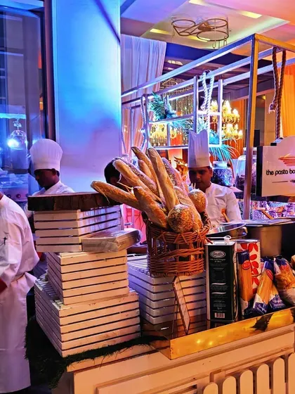 We bring the energy of a live kitchen to your event. Here is one of our chefs at an interactive pasta station, part of a bespoke setup for a corporate event at Hotel Andaz, New Delhi.