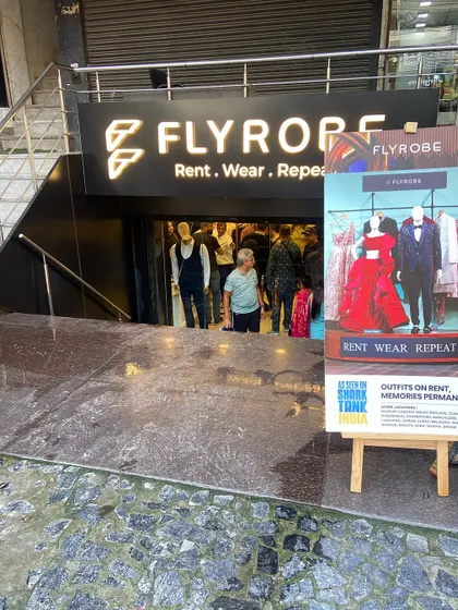 The entrance to our store, inviting you in to explore the world of rental fashion. You can see our "As seen on Shark Tank India" poster right at the front.