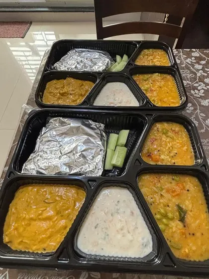 I get many requests for a kids-friendly tiffin service. This is a typical meal I prepare for children, with soft rotis, a mildly spiced paneer gravy, wholesome bisibelebath, and cooling raita, all made with less spice and lots of love.