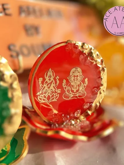 A detailed shot of the radiant red Lakshmi Ganesh standee. The deep red color symbolizes prosperity and is a traditional choice for festive decor.
