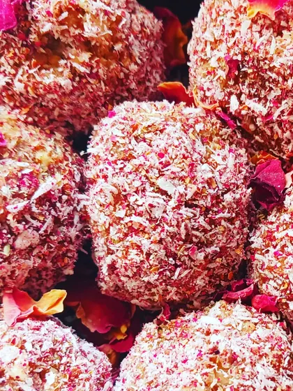 Rose Coconut Jaggery Laddoos made for Holi. These no-cook, dairy-free sweets are flavoured with organic jaggery and desi rose petals.
