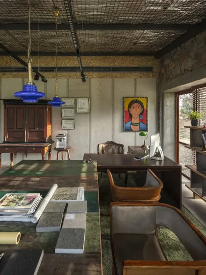 A view of our studio, featured in Architecture + Design. The space itself is a mood board of our philosophy, combining raw concrete, natural stone, and reclaimed wood with art and bespoke furniture to create an inspiring environment for our team.
