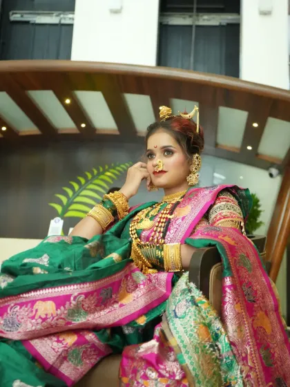 A regal pose showing the bride's confident posture and the luxurious fall of her saree.