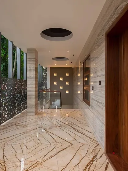 This is a duplicate of ID 62. A corridor in a luxury home featuring beautifully veined marble flooring and wall cladding.