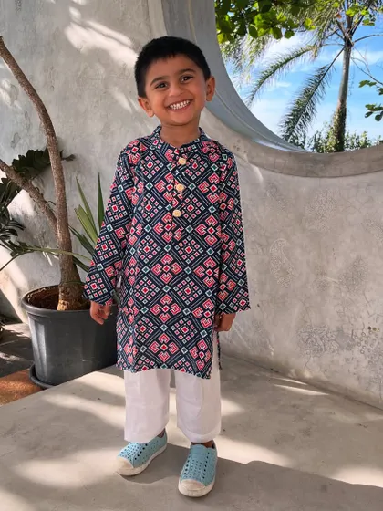 Who says ethnic wear for boys can't be fun? This Patola print kurta is one of my favorites. It’s crafted from breathable cotton, so your little man can run, jump, and play comfortably while looking incredibly dapper.