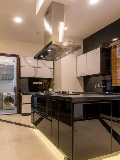 A view of the island kitchen showing the seamless integration of the hob and the ample workspace provided by the island.