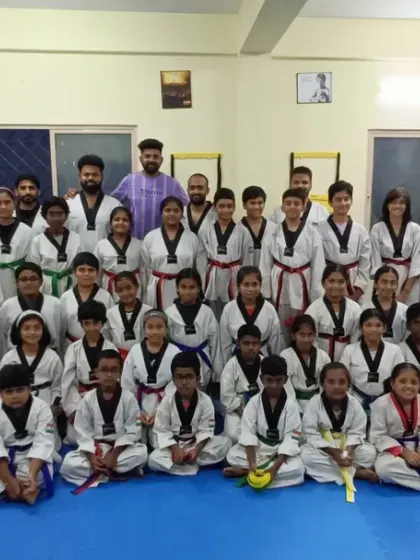 A proud group of students after their belt exam. It's wonderful to see them all progress together.