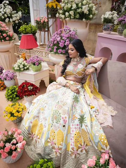 The bride looking radiant in a setting filled with an abundance of colorful flowers. This showcases our ability to create picturesque, floral-heavy environments that are perfect for wedding portraits.