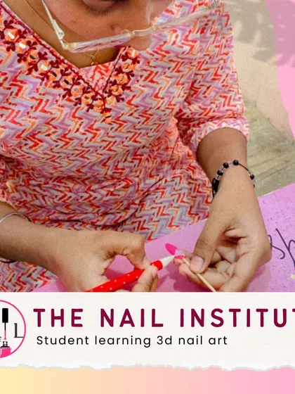 This student is learning 3D nail art, sculpting small, intricate designs that make the nails pop.