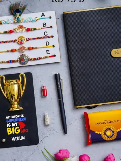 A superhero-themed Rakhi gift set. It features a personalized diary and pen, a 'My Favorite Superhero is my BIG BRO' plaque, a selection of rakhis, and chocolate.