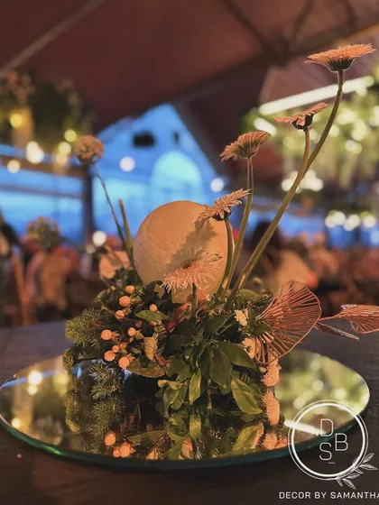 Centerpieces taking center stage. For the KGA's 50th year celebration, we used playful moon orbs within the floral arrangements to add a touch of drama and whimsy.