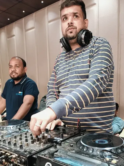 A candid shot while I'm focused on the music. It's all about delivering a great performance for the client.