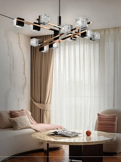 In this living room, a modern sculptural chandelier becomes the centerpiece. The design combines sharp angles with crystalline elements, providing brilliant, multi-directional light that is both functional and a work of art.