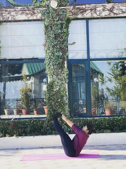 Another angle of Boat Pose, showing the engagement of the core muscles. Finding stability in a challenging pose teaches us to find stability in life.