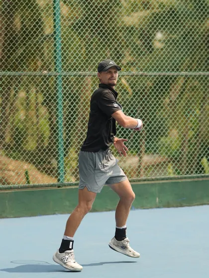 An athlete mid-rally during our Goa High Performance Camp. The serene landscape provides a focused environment for total athlete development.