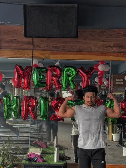 A member posing with our Christmas decorations. The gym is more than just a place to work out, it's a place to feel good and share positive energy.